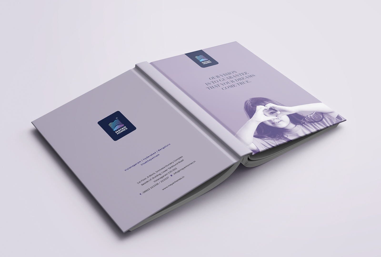  Mayan Homes brand diary cover with tagline Our Vision is to Guarantee that Your Dreams Come True and a child making a heart symbol with hands